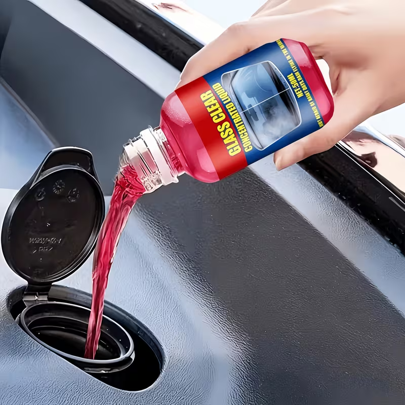 Glass Clear Concentrated Liquid being poured into car washer reservoir